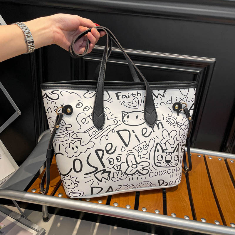 Nicho de diseño de graffiti bolso para mujeres 2025, nuevo bolso de hombro de mano casual, bolso de brazo de viaje de gran capacidad