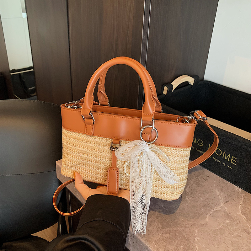 Bolso de vacaciones junto al mar 2025 verano nuevo bolso bolso de hombro de color de contraste tejido de paja bolso de mensajero de playa para mujer