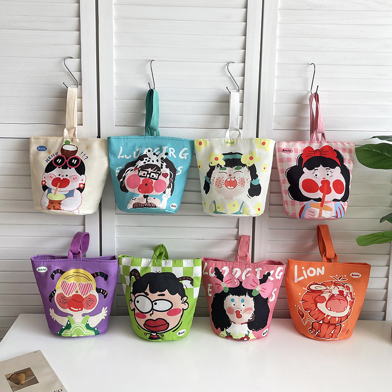 涂鸦轻便包包女手提小布包甜美个性印花圆筒包水桶包简约休闲女包
