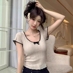 フランスの甘い蝶結びのニットのtシャツの女性の夏の新型の高級感は色の透かし彫りの独特な半袖の上着にぶつかります。