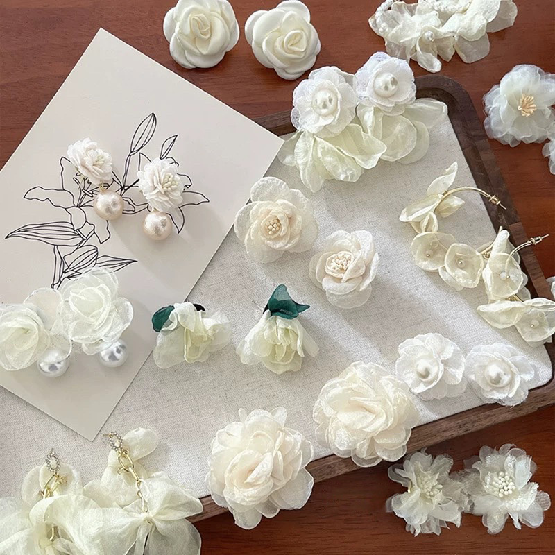 Pendientes de borla de flores de hilo de malla de perlas de aguja de plata Pendientes frescos y dulces de primavera y verano Pendientes de moda de deseo puro de súper hada al por mayor