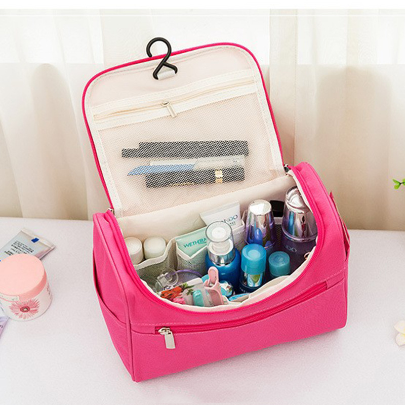 Capacious handheld cosmetic bag