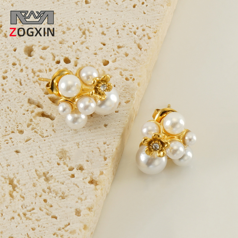 Cross-border nuevos pendientes de perlas de acero inoxidable femenino europeo y americano nicho irregular diseño luz pendientes de lujo pendientes al por mayor