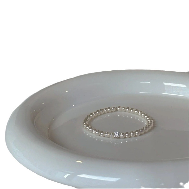 Pulsera de perlas de circón Pulsera de temperamento simple y elegante francesa Moda de lujo ligero Retro de alta gama Joyas al por mayor para mujer