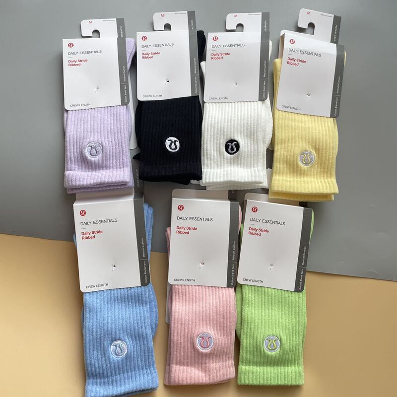 New Lulu women's towel-soled embroidered sports socks in candy colors, trendy mid-high socks, wholesale and dropshipping available New Lulu women's towel-soled embroidered sports socks in candy colors, trendy mid-high socks, wholesale and dropshipping available