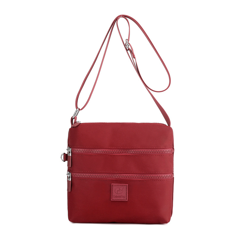 Bolsos de tela pequeños al por mayor, bolsos de nylon, bolsos de hombro para mujeres, tendencia coreana, mochilas ligeras al aire libre, bolsos de tela prácticos de varias capas