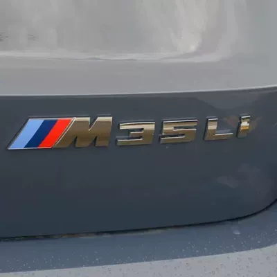 Car logo, SDrive 18Li, 20Li, 25Li side