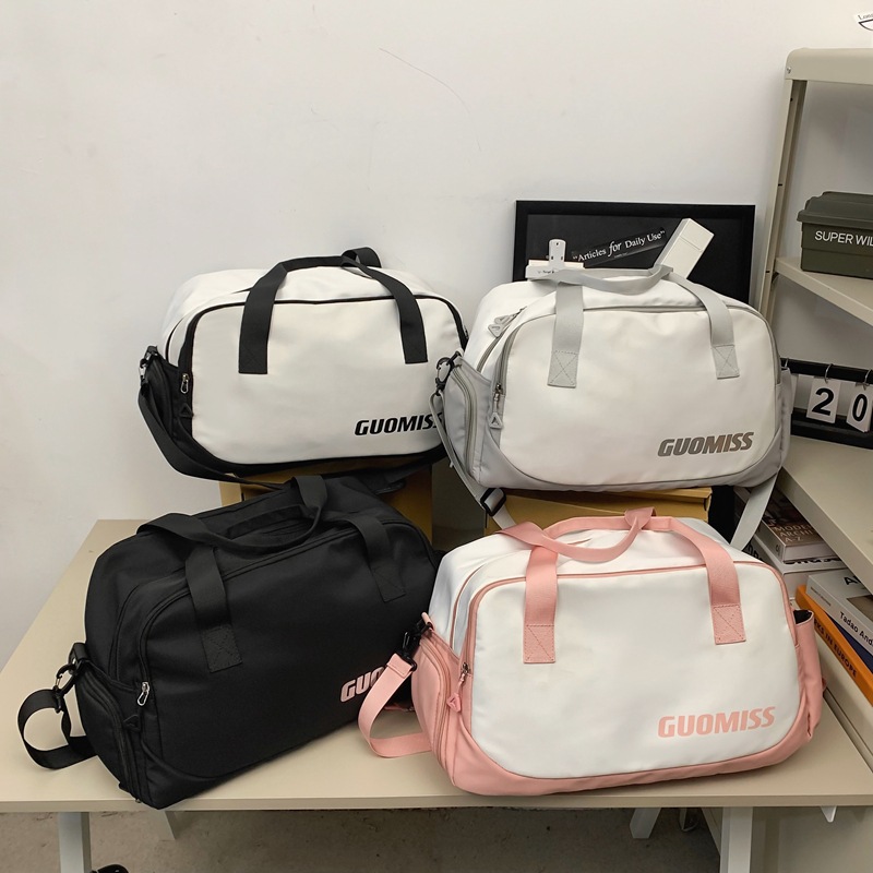 Nueva bolsa de viaje corto simple de gran capacidad de viento para hombres y mujeres bolsa de ocio deportiva bolsa de ejercicio bolsa de mochila