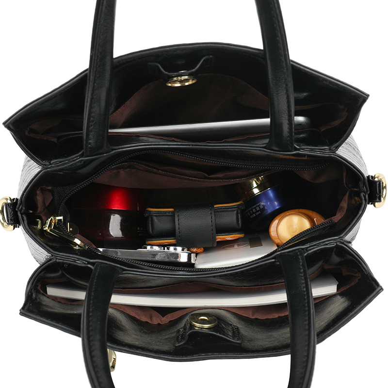 Retro alta sensación de bolso 2025 nuevo estilo de moda temperamento bolso de mano de tendencia nicho popular gran capacidad mochila