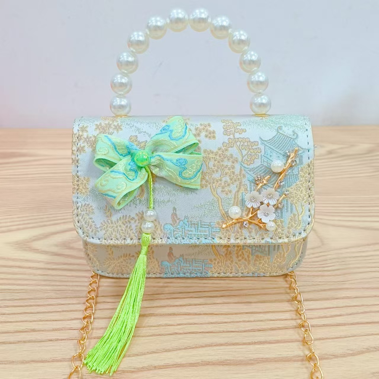 Bolsas de niños arco de estilo chino borda de niña pequeña princesa perla bolsa de cambio de mano al por mayor