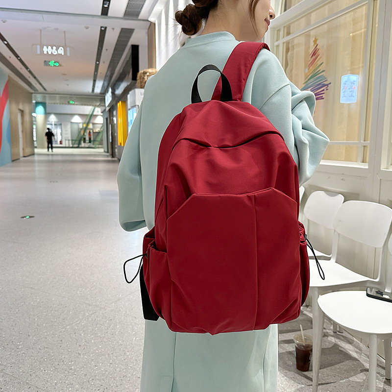 Nueva mochila de alta capacidad de la moda fresca de color sólido bolsas de viaje de estudiantes de secundaria secundaria ocio simple mochila de computadora