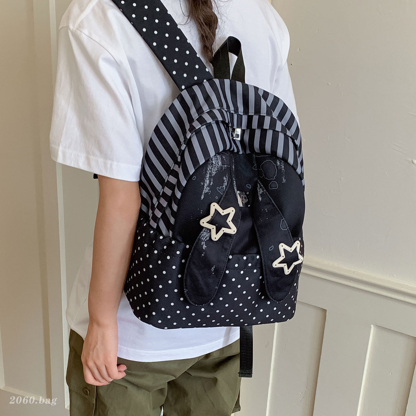 Universales estudiantes lindos clase de nicho ligero 2026 nuevas orejas de gran capacidad mochila de mujer mochila de punto de onda conejo