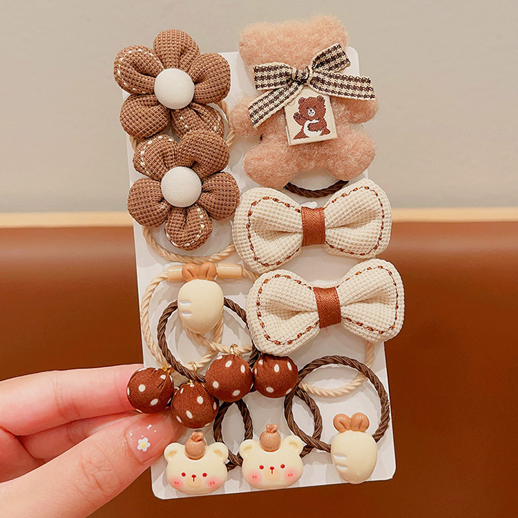 La banda de goma de la flor marrón de la leche de las muchachas de la venda de los niños no lastima el pelo banda elástica alta del pelo de la cola de caballo