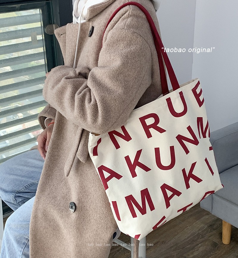 Bolsa de compras de lona de gran capacidad estilo europeo nuevo 2025 estilo ins perezoso para mujer, bolso de hombro para estudiantes, literario y simple.