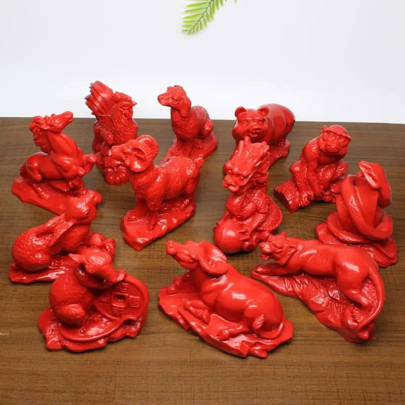 Набор из трёх украшений из киновари с двенадцатью знаками зодиака: Крыса, Бык, Тигр, Кролик, Дракон, Змея, Лошадь, Овца, Обезьяна, Петух, Собака, Свинья.