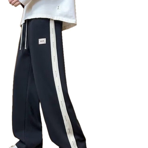 Pantalones casuales de hombre, tendencia de otoño y invierno, pantalones rectos de tamaño grande, pantalones deportivos elásticos de cintura delgada y caída.