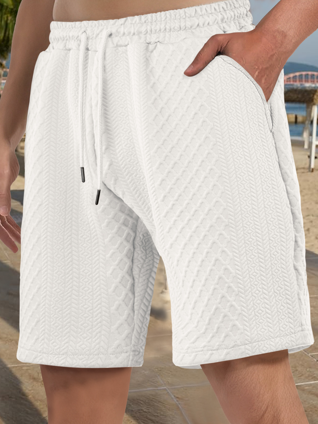 Europa y Estados Unidos ropa de hombre transfronteriza spot verano suelta pantalones cortos de color sólido jacquard correa de hombre casual pantalones cortos de playa