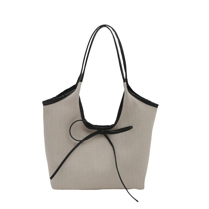 Capacious shoulder bag, one-shoulder bag with bow, western style