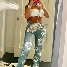 HR23123  欧美时尚女装  弹力牛仔面料木棉花印花牛仔长裤