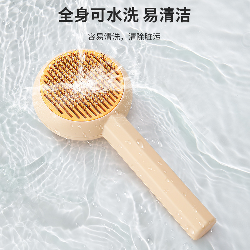 Cross-border nuevo peine mascota gato de acero inoxidable aguja peine masaje cepillo de eliminación de pelo de un solo clic de eliminación de pelo de perro peine de eliminación de pelo