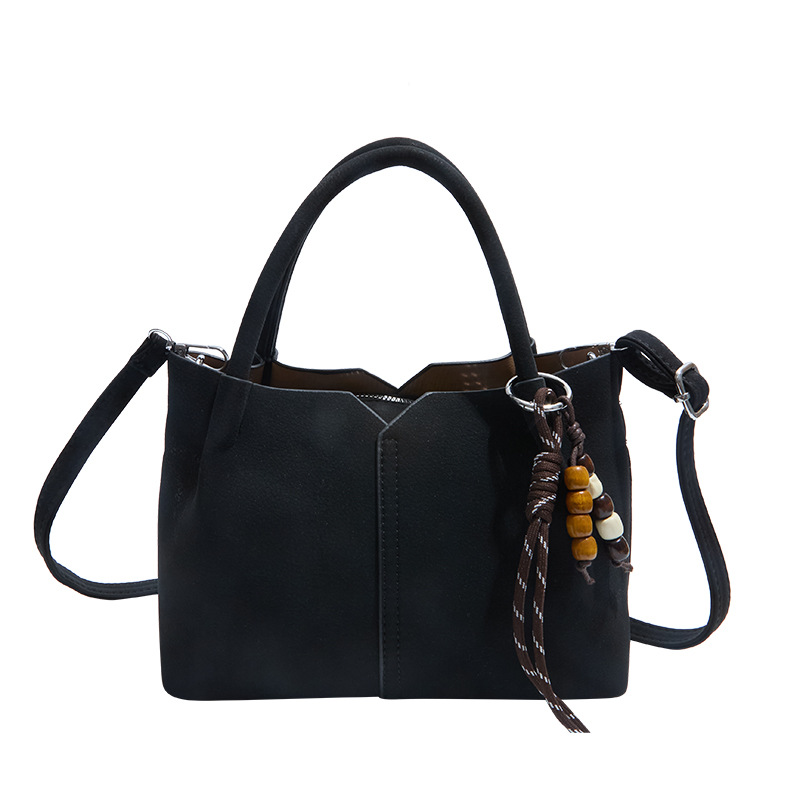 Bolso de mano de alta sensación de moda bolso de balde de mujer 2025 invierno retro simple bolso de hombro temperamento mochila de viaje
