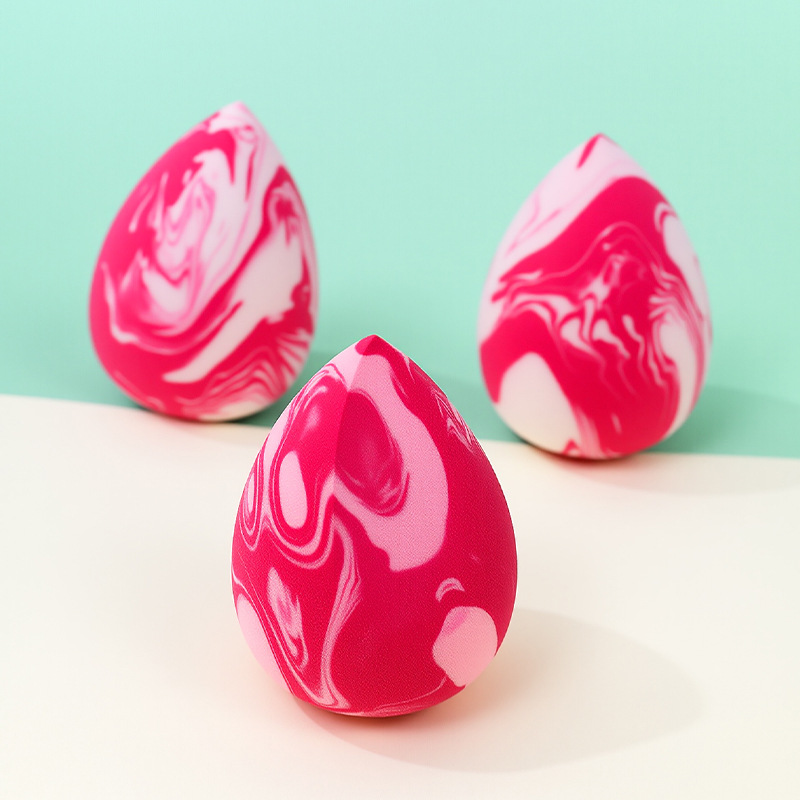 La borla de polvo de huevo de belleza de color mixto transfronterizo se agranda cuando se encuentra con el agua, gotitas de agua, esponja de maquillaje sin látex en forma de calabaza, personalización de fábrica de huevos