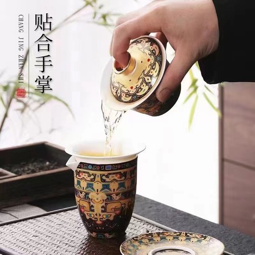 Enamel-colored jade porcelain tea set with rotating Tangka suspended lid teapot and Fengming Xishi teapot set