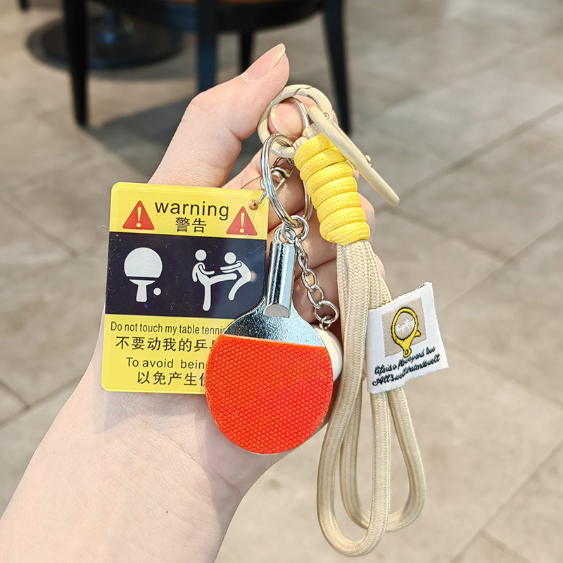 Kicking ping pong warning sign + big ping pong ball + khaki double rope