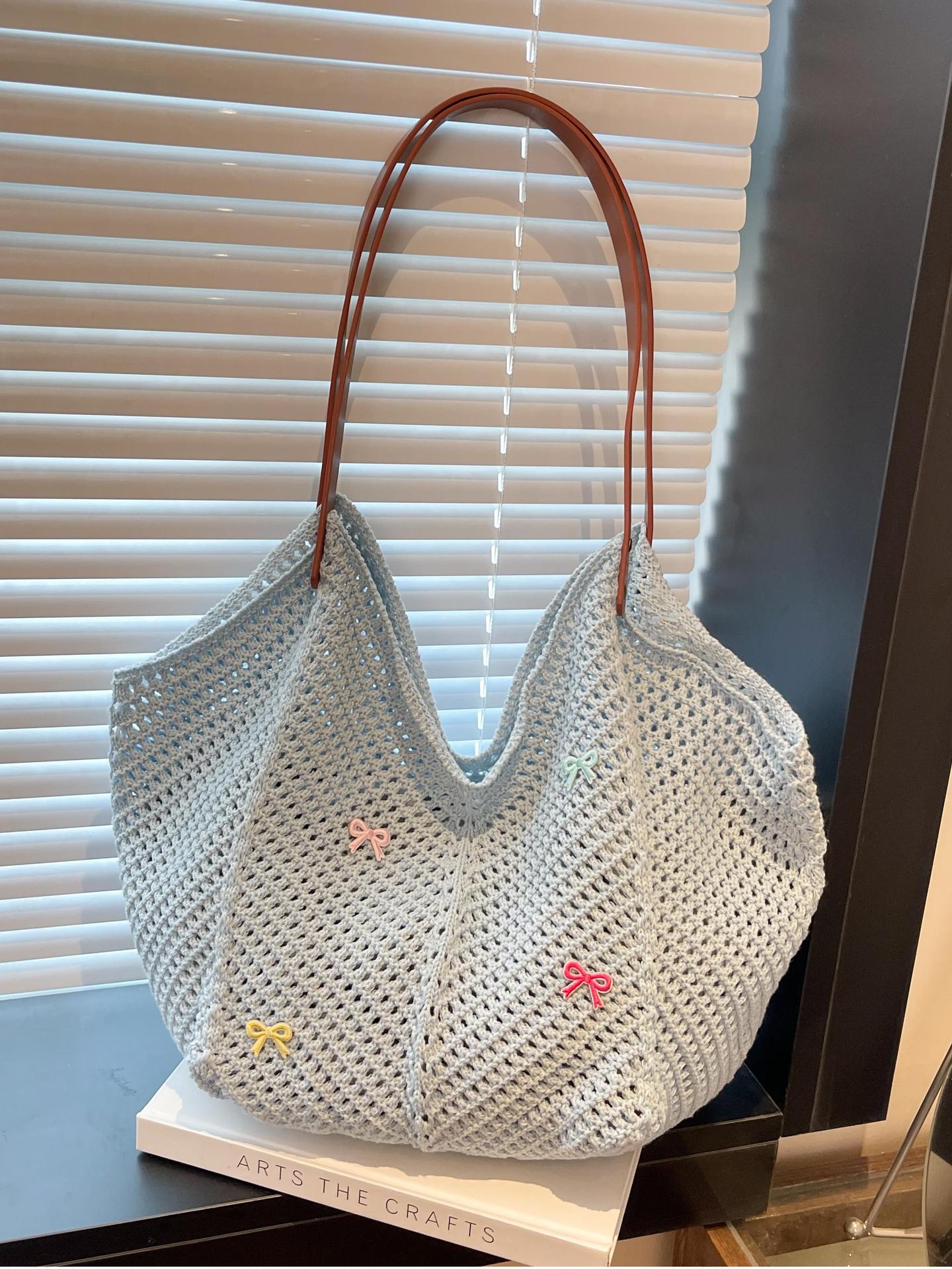 Viaje junto al mar estilo vacaciones bolso de playa tejido hueco mujer 2025 verano nuevo bolso tejido de paja bolso de alta capacidad