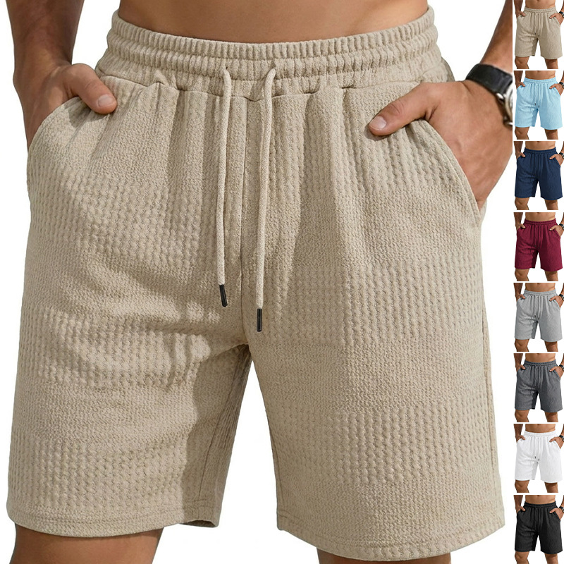 Fábrica europea de ropa de hombre transfronteriza en stock TK paleta suelta tela jacquard de banda larga de hombre pantalones cortos casuales de playa image 1