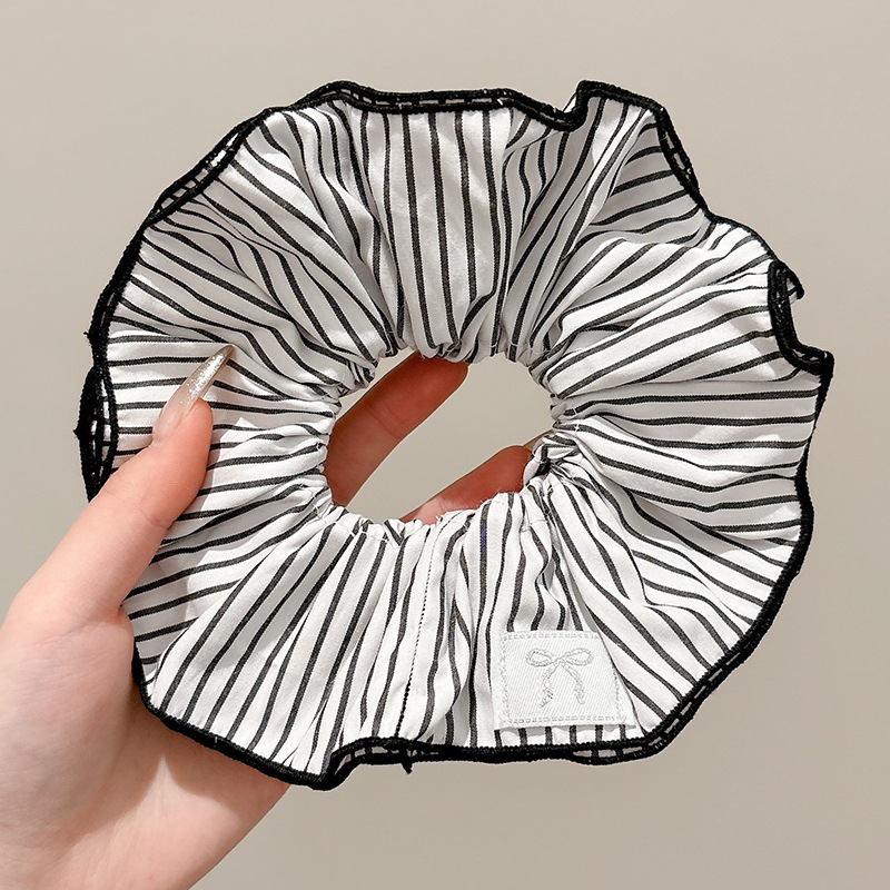 Pastoral viento intestino anillo de cabello mujer 2025 nuevo estilo de alta sensación bola de cabello cuerda de cabeza flor dulce princesa adornos de cabello cuerda