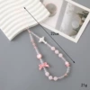 Fuchsia beaded bracelet with bow, mobile phone