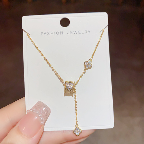 Light luxury niche design, high-end, small waist, four-leaf flower necklace, tassel, sweet temperament, fashionable and versatile clavicle chain