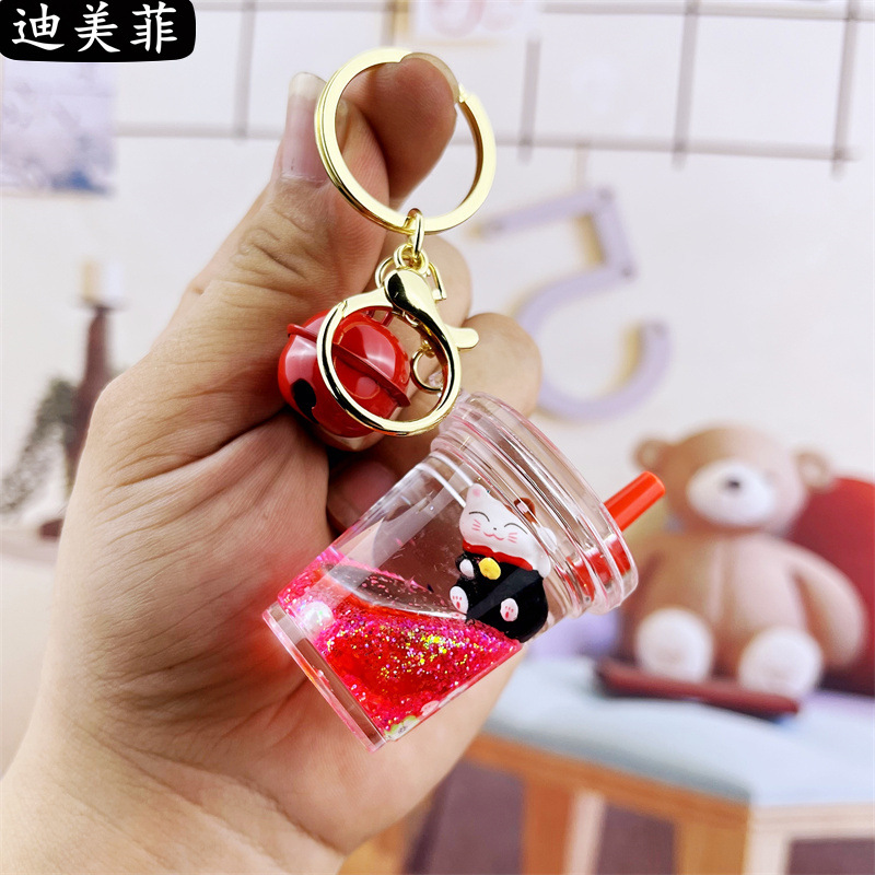 Té con leche rojo gato de la suerte de oro negro