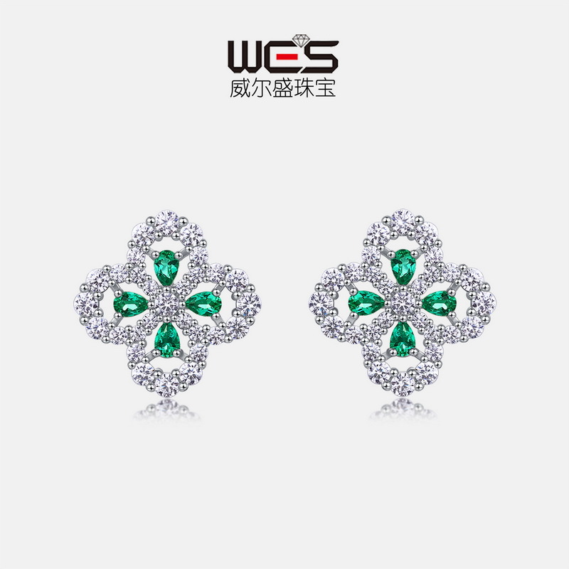 Pendientes de trébol de cuatro hojas de lujo ligero de estilo explosivo transfronterizo europeo y americano S925 con incrustaciones de plata para cultivar aretes de esmeraldas brillantes al por mayor