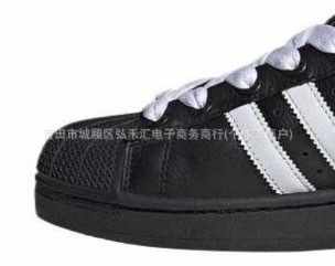 Second generation Black Shell-white shoelace model (white label on tongue)