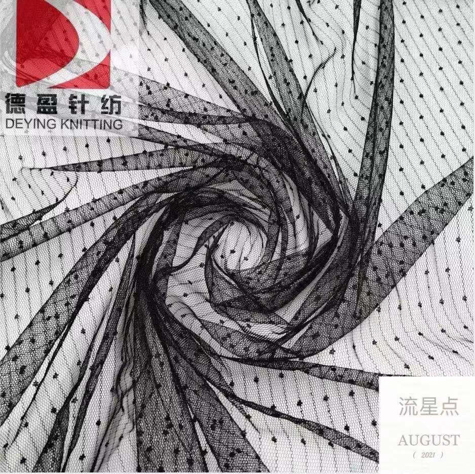 新款网纱提花面料 锦纶流星点网布现货网纱童装女裙包装面料
