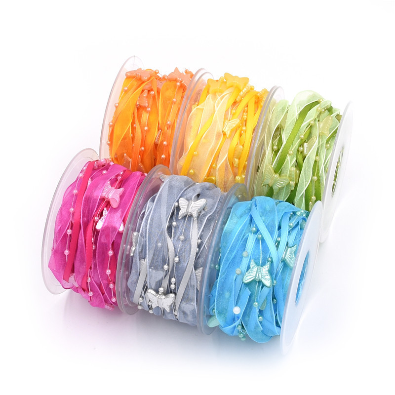 Nuevo transfronterizo primavera mariposa cadena de cuentas decoración cinta de mano material de jardinería de poliéster tejido a mano cinta