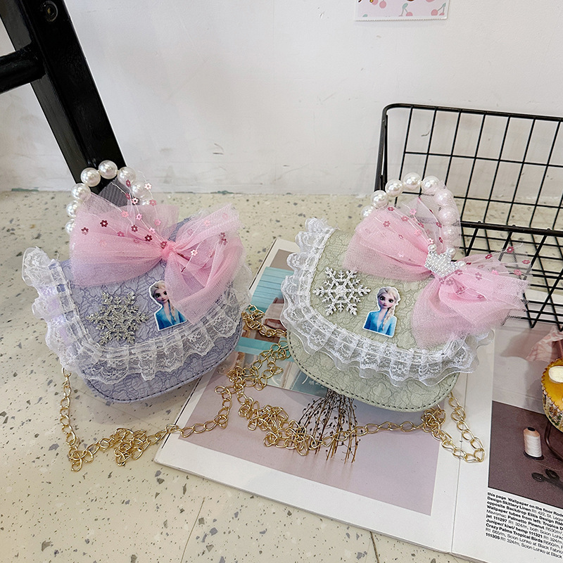 2025 nuevo bolso de perla para niños arco encantador caricatura cadena de estilo exterior bolsa de cambio de moda versátil