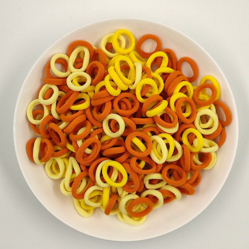 Color de caramelo de alta elasticidad pequeña toalla anillo de cabello bebé anillo de cabello no daña cabello atado fábrica de cabello al por mayor