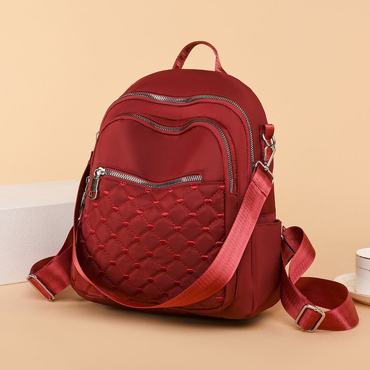 Primavera y verano nueva moda multifuncional de doble uso un solo hombro y doble hombro bordado estilo universitario deportes al aire libre tiro real bolso femenino al por mayor