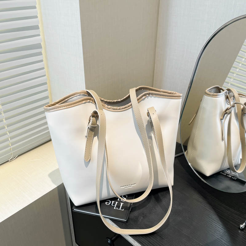 2025 primavera nueva versión coreana de la personalidad brazo bolso de mano de estilo casual simple de viaje bolso de hombro