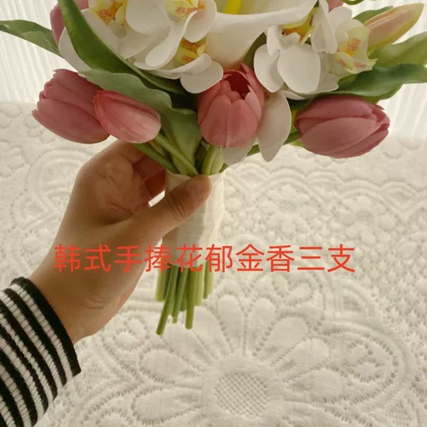 Korean style bouquet of three tulips.