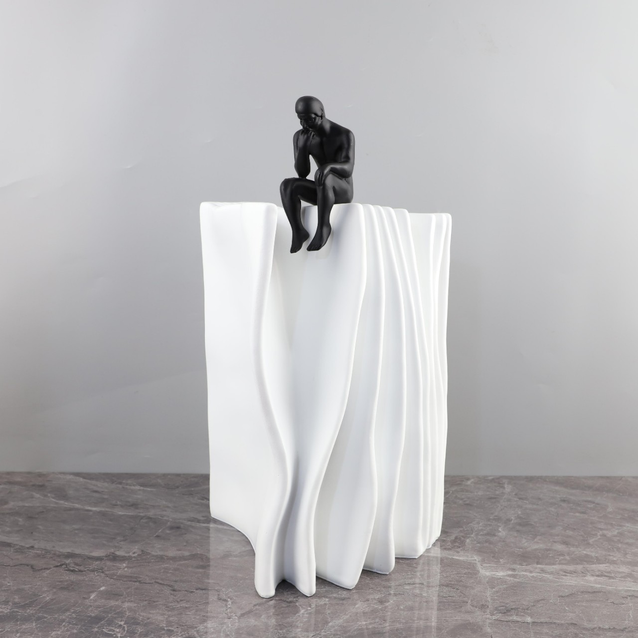Modern minimalist abstract contempreters sitting in the book resin…