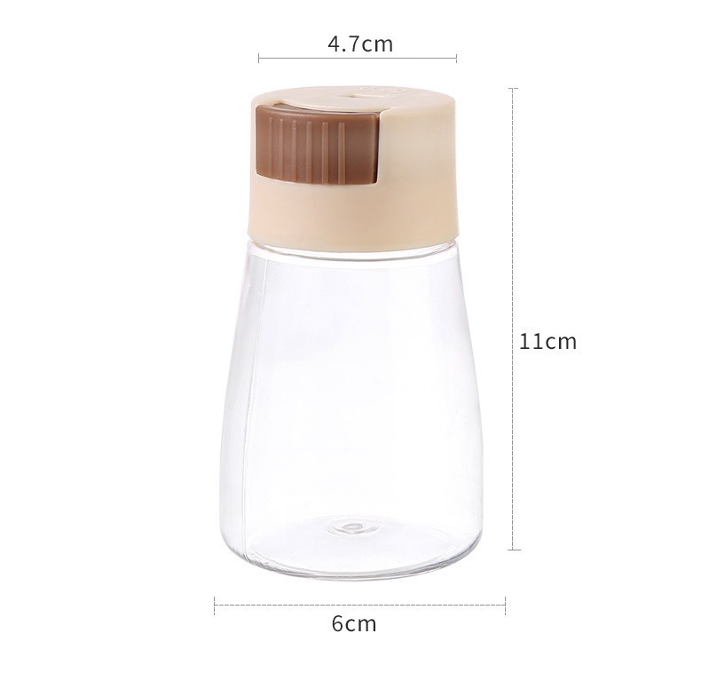 Press-Dispense Salt Seasoning Jar Pink Hexagonal Sealed Kitchen Condiment Bottle for Home Cooking in use