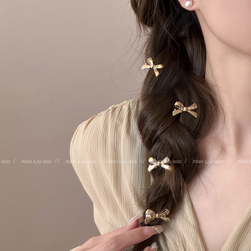 甘いクールな蝶結びの金属の小さいサイズのヘアピンの女性の側の耳のクリップの額の無痕の前髪の砕毛のクリップの髪飾り|undefined
