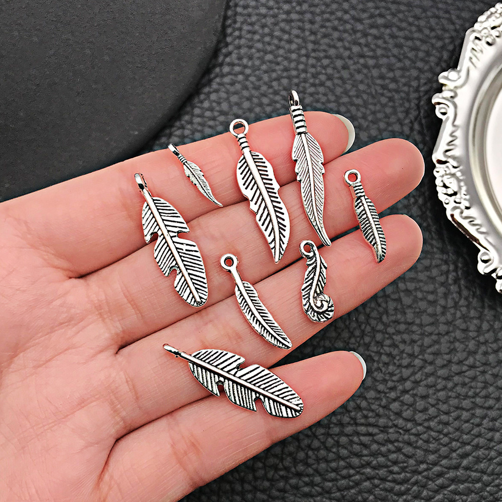 Venta caliente transfronteriza aleación retro hoja pluma collar pendiente colgante accesorios de joyería de bricolaje fábrica al por mayor