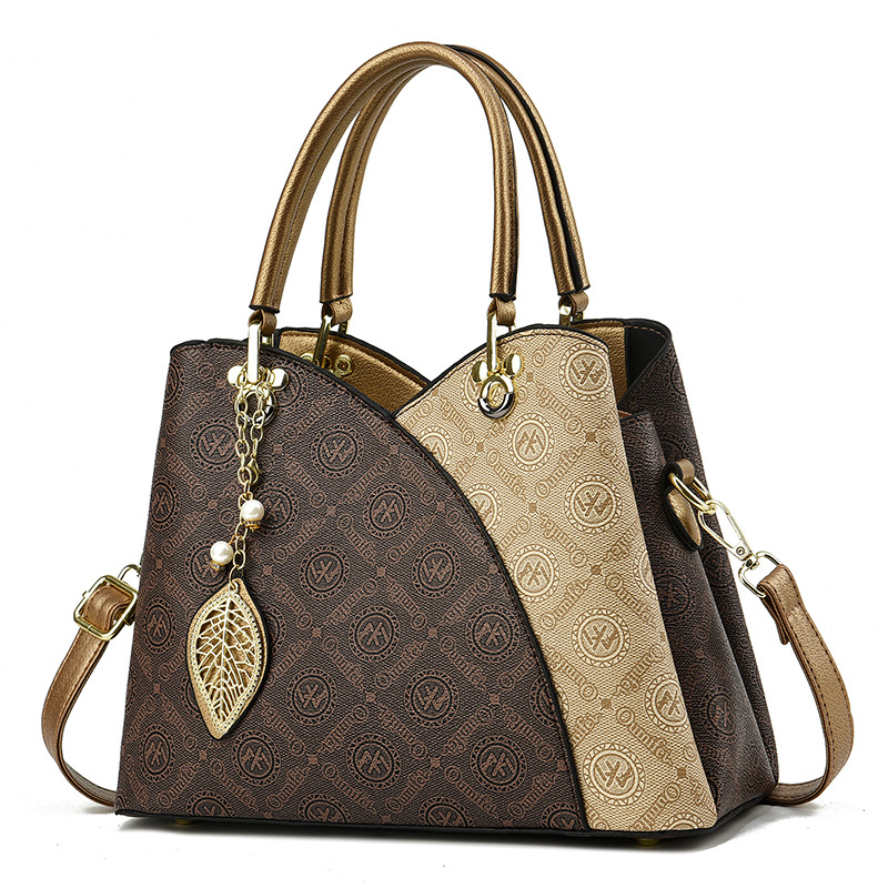 2025 verano nuevo bolso de moda de mediana edad bolso de mujer bolso de hombro mochila atmósfera bolso de madre universal