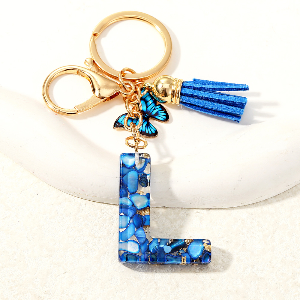 Nuevo transfronterizo mariposa 26 letras inglesas de cristal goteo llavero bolsos accesorios colgante de automóviles