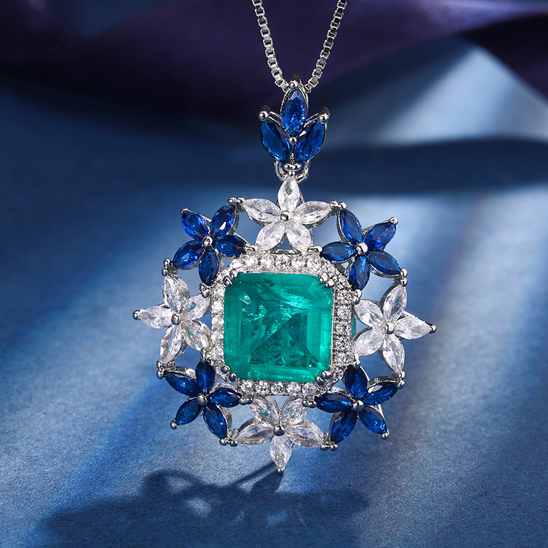 Zhuang Sheng joyas de cobre inferior chapado en oro joyería traje simulación rojo corindón Esmeralda flor forma traje femenino 10*10